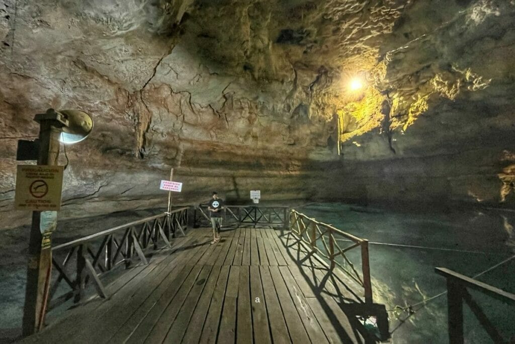 Multum-ha cenote platform guy walking
