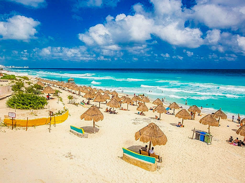 Beach with umbrella and turquoise water