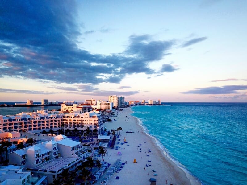 cancun beach coast with sunset