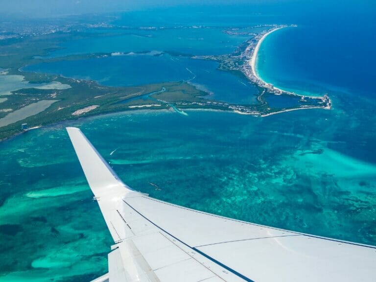 plane flying over Cancun