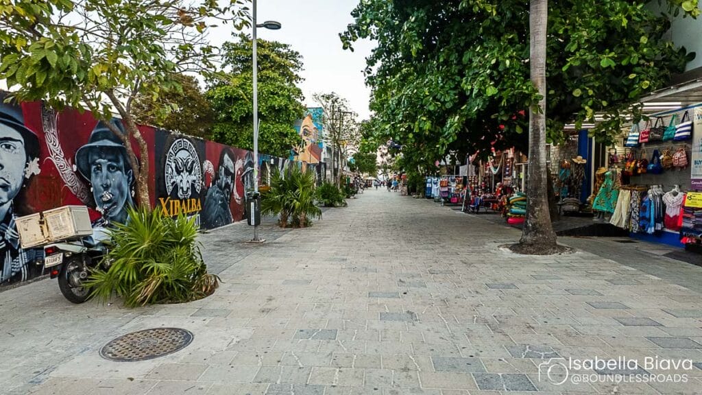 Colorful street with murals and shops