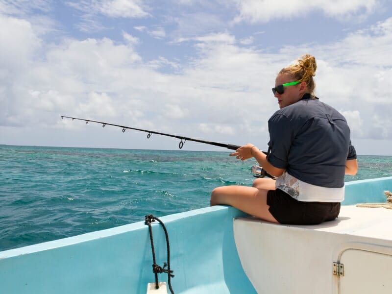 Woman deep sea fishing