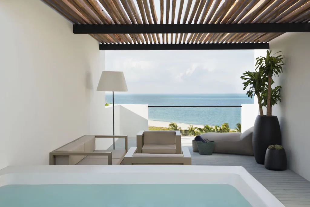 view of the ocean and terrace from the room at finest playa Mujeres in cancun