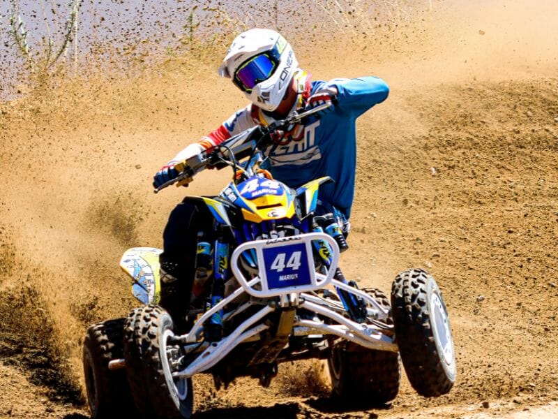 A participant in full blue gear on one of the ATV tours in Cancun.