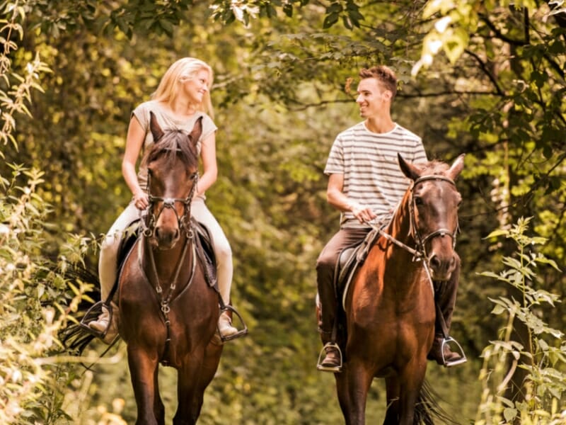 couple riding horses in Mexico