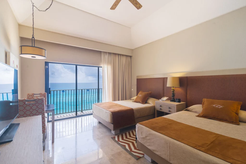 Two double beds in The Royal Sands room
