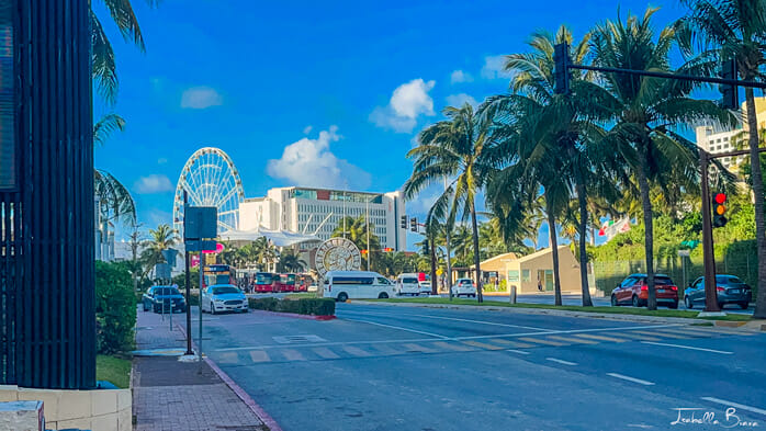 View of the Cancun Hotel Zone road and a Ferris wheel