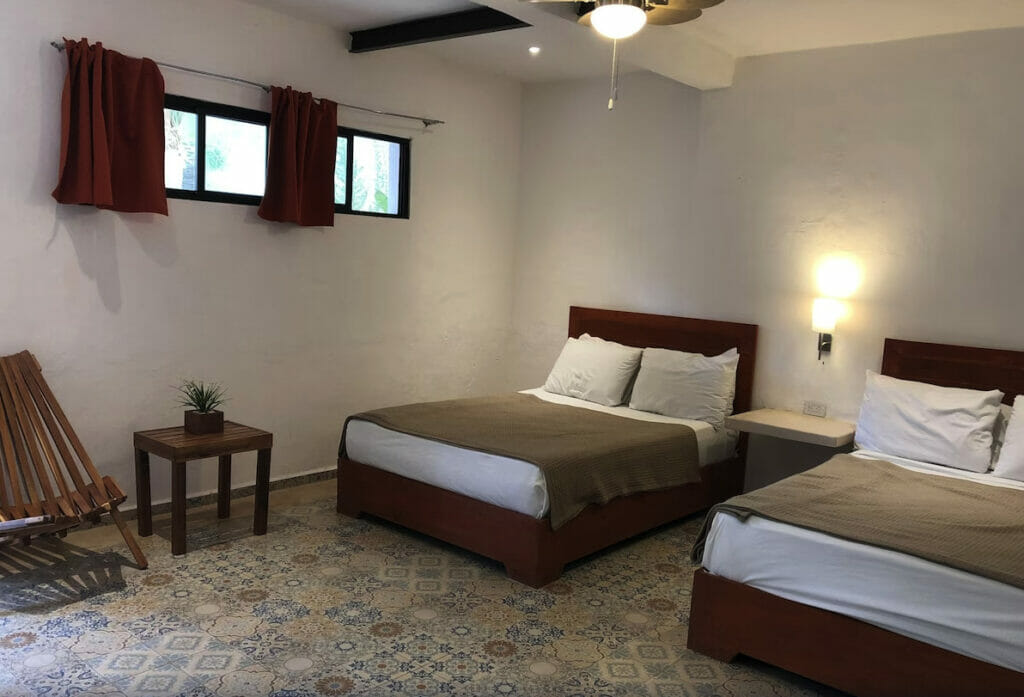 Room at Casa Bamboo with 2 beds and white walls