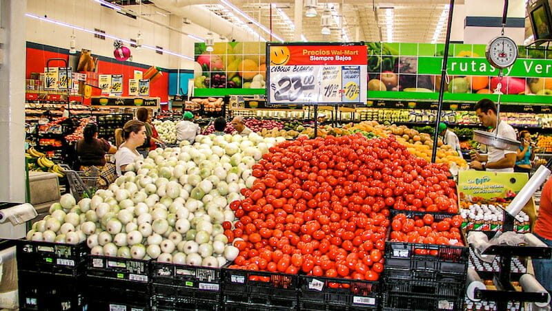 View of the vegetables section with fresh tomatoes and onions