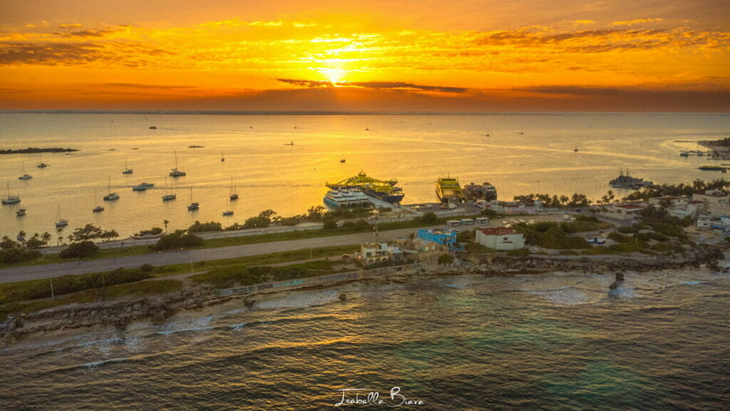 View of the sunset in Isla Mujeres and Carribean coast -where to rent a car in Cancun?