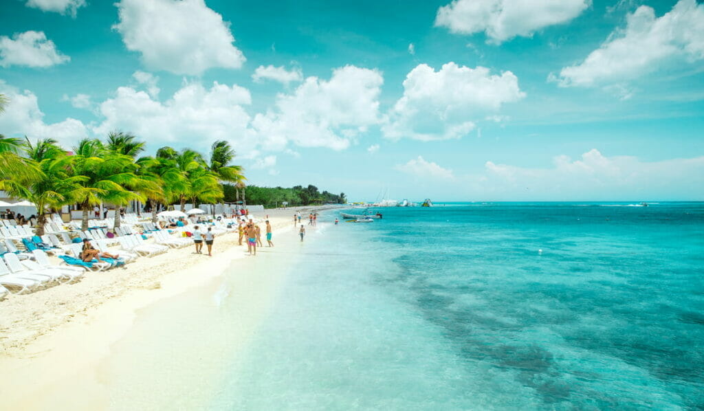 Cozumel Beach filled with tourists.