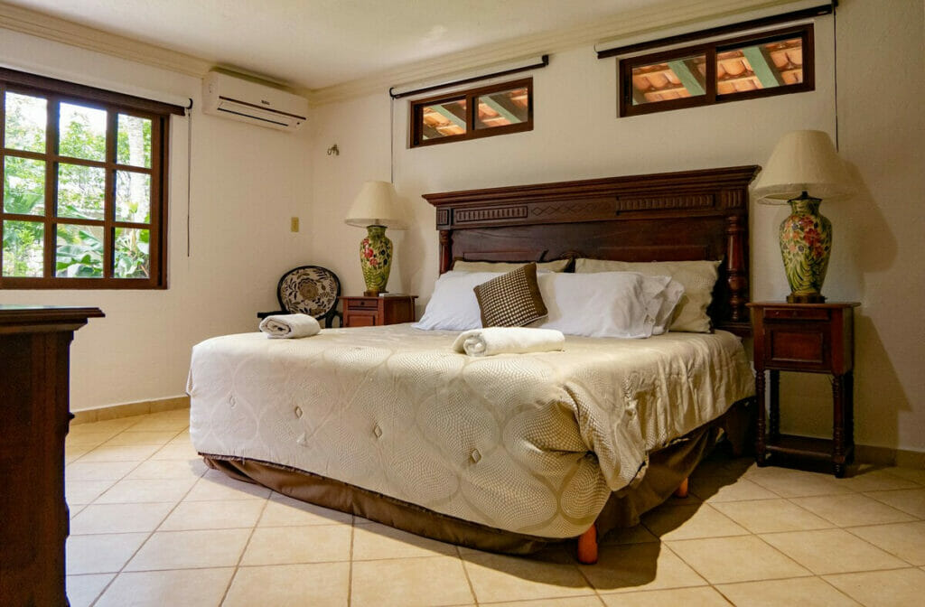 A cozy hotel with a comfy bed.