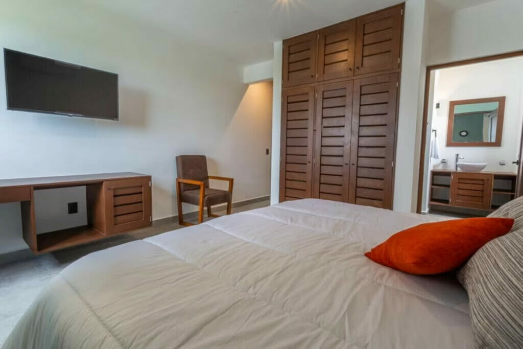 View of a room with a bed, bathroom in Cancun.