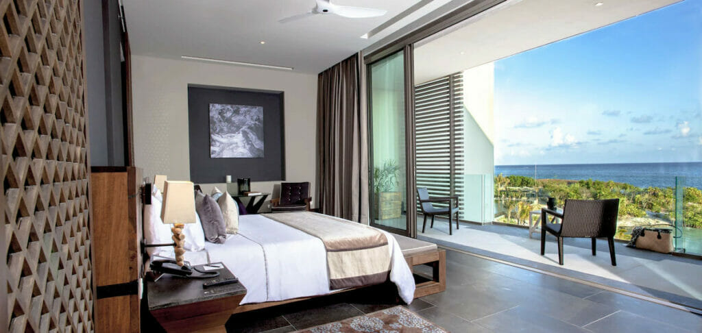 One of the best dog-friendly hotels in Cancun with a cozy bed and a huge balcony.