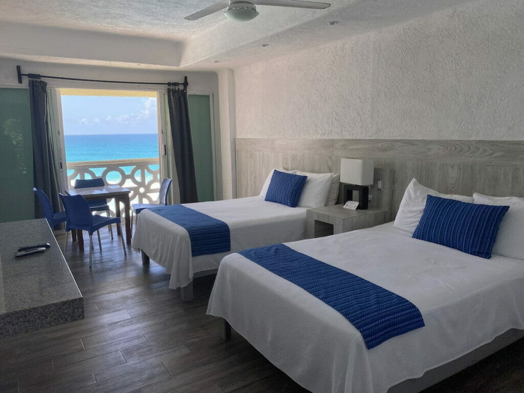 Cancun Plaza room with a couple of beds.