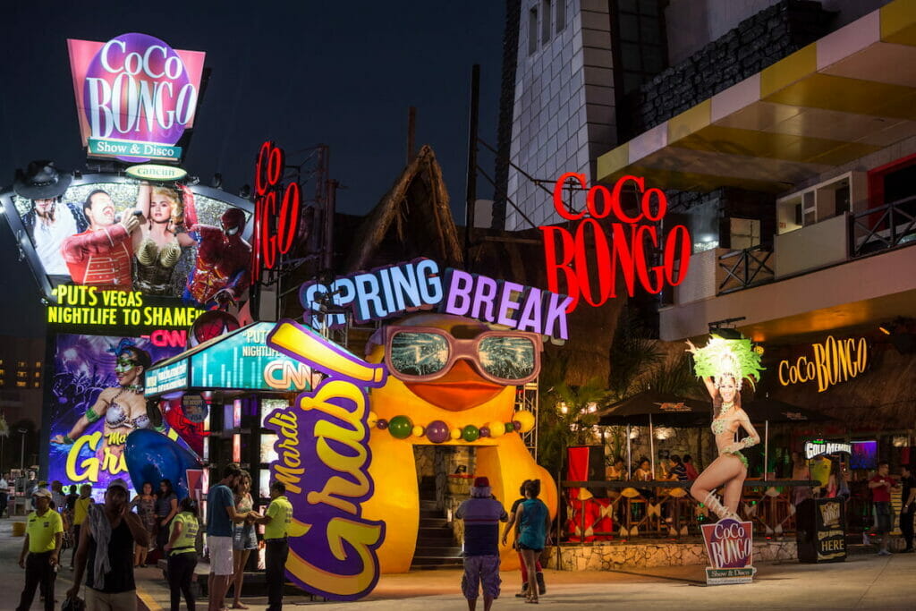Exterior view of Coco Bongo in Cancun at night.