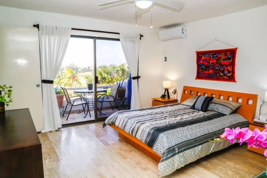 Cozy room in Hostel Natura with the view of the bed and balcony.