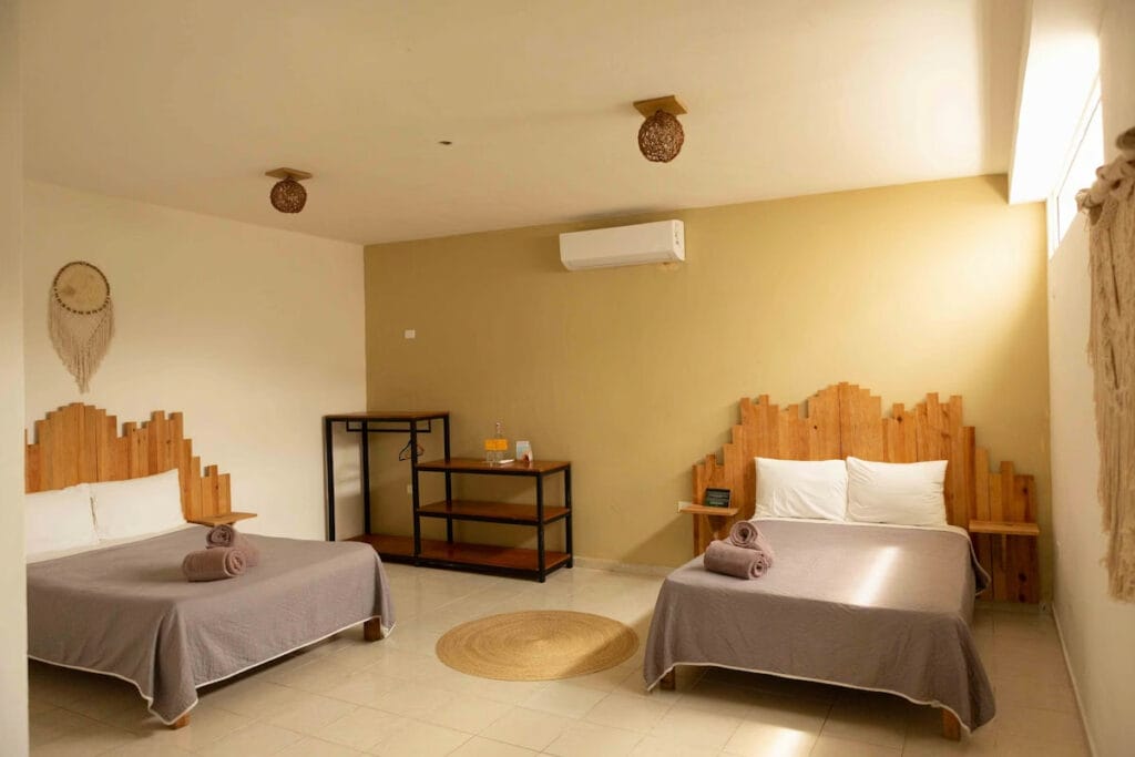 A couple of beds in a Mezcal Hostel room - one of the best hostels in Cancun.
