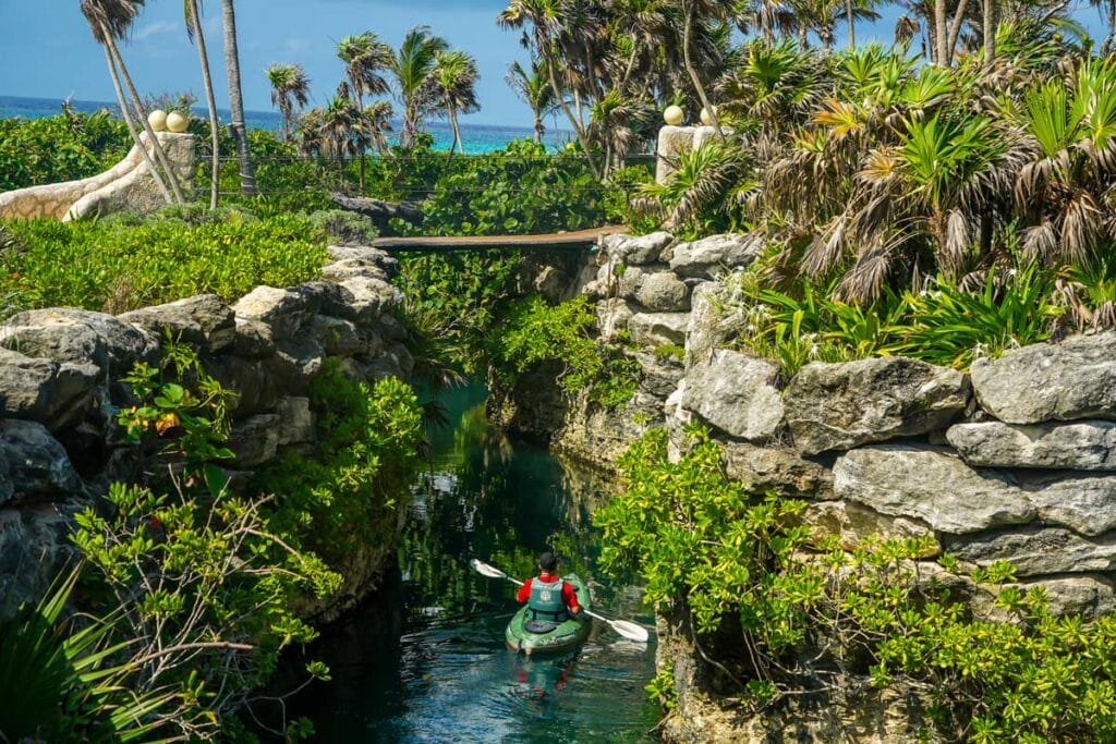 Xcaret people kayaking under a bridge