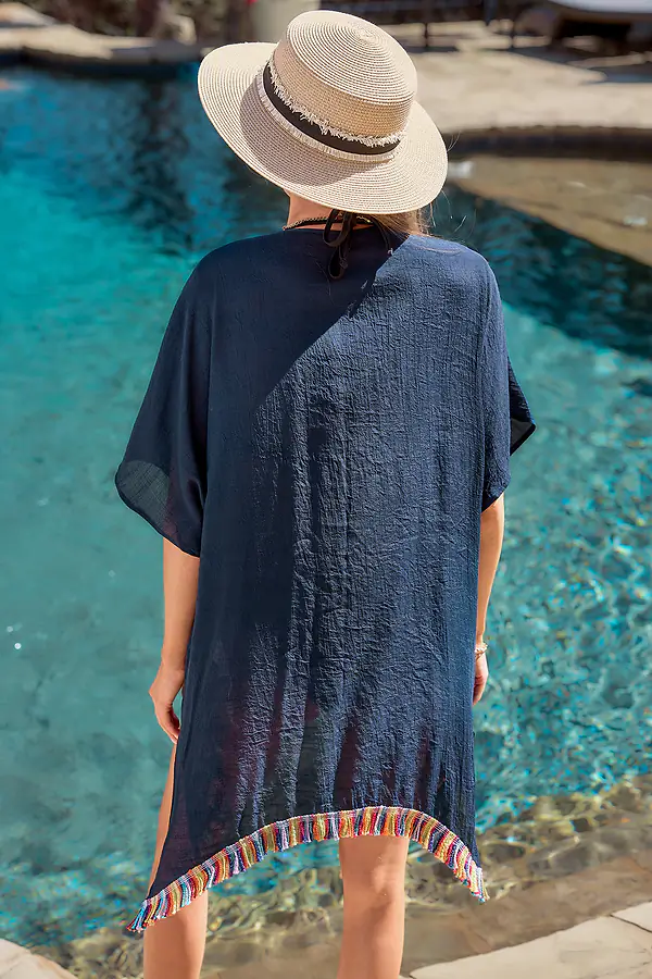 Woman in navy cover-up by pool