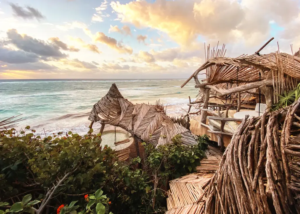 Rustic oceanfront hut with breathtaking sunset views.